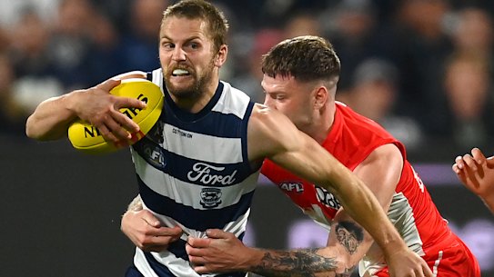 Tom Atkins tackled by Peter Ladhams.