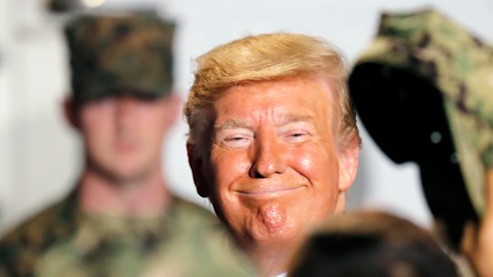 US President Donald Trump greeted US servicemen at the Yokosuka Naval Base on Tuesday.