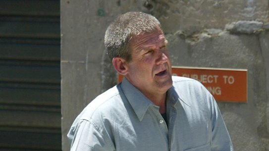 Bradley John Murdoch is escorted, in handcuffs from the Adelaide Magistrates’ Court after facing an extradition hearing in 2003.