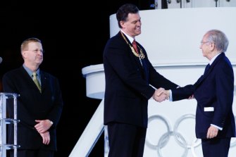 John Coates (left) and Olympics Minister Michael Knight receive awards from Juan Antonio Samaranch at the closing ceremony.