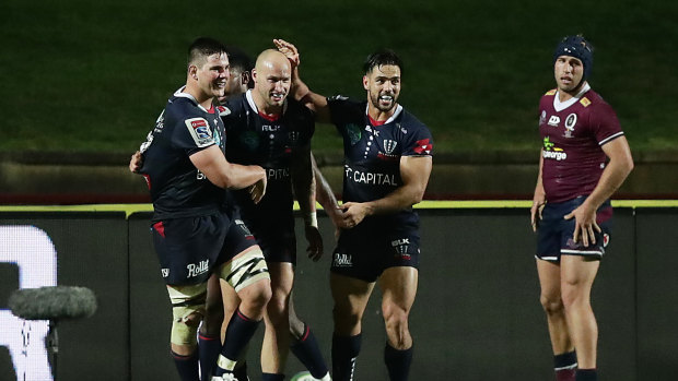 Rebels centre Billy Meakes scores a try against the Reds in Super Rugby AU. 