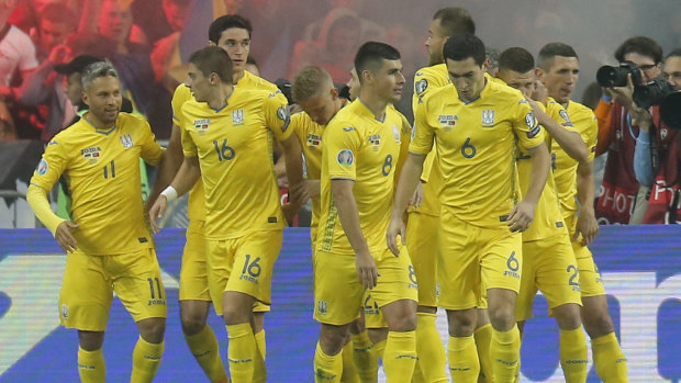 Ukraine's players celebrate a goal.