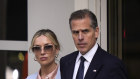 Hunter Biden and his wife, Melissa Cohen Biden, leave federal court.