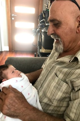 John Habib with his grandchild Frankie-Jean.