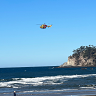 A woman has died and three others were taken to hospital after getting into difficulty in the water on Sunday. 