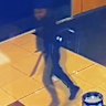 A still from CCTV footage of a youth carrying a machete at Caroline Springs Square shopping centre on Friday night.