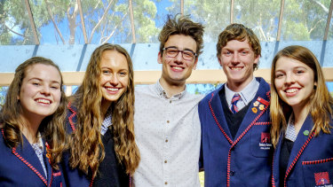 Sunbury Downs College students (L-R) Amber Karras , Jemma Denman, Adam Lacy and Kristina Zboril with past student Rory Healy (centre)  at the college campus in Sunbury.