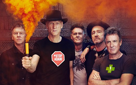 Bones Hillman, centre, joined Midnight Oil in 1987.