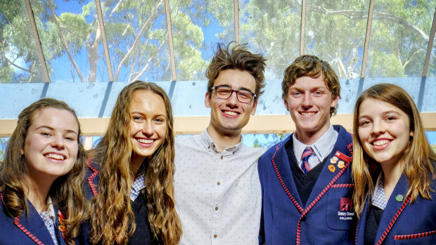 Sunbury Downs College students (L-R) Amber Karras , Jemma Denman, Adam Lacy and Kristina Zboril with past student Rory Healy (centre)  at the college campus in Sunbury.