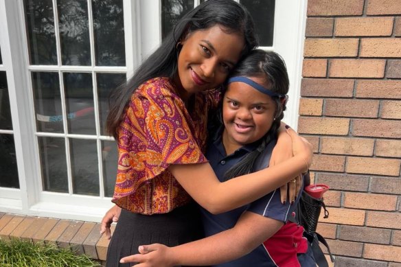 Satara Uthayakumaran and her sister Karuka, who has Down syndrome and is deaf.