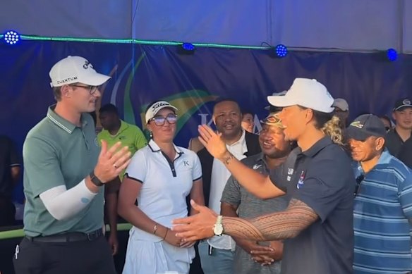 Jarome Luai greets the winner of the PNG Open, Josh Armstrong.
