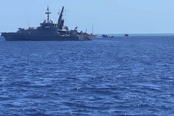 An Armidale-class patrol ship operated by the Australian Navy rounding up the illegal vessels within the Rowley Shoals Marine Park and escorted them off the reef on Thursday.