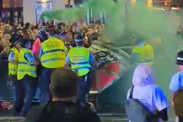 Police and protesters clash in an incident on the Mardi Gras route.