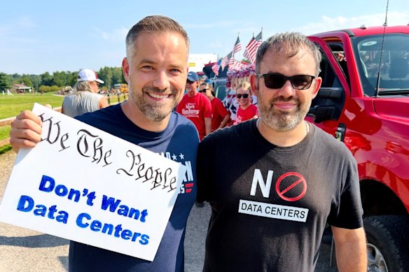 Brandyn Bernard, right, a former Trump voter who is now campaigning against data centres with Jerrad Christian, a Democrat who is running for US Congress.