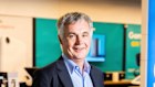 Optus CEO Stephen Rue says he will invest in artificial intelligence but will not follow Telstra’s lead and form a big joint venture