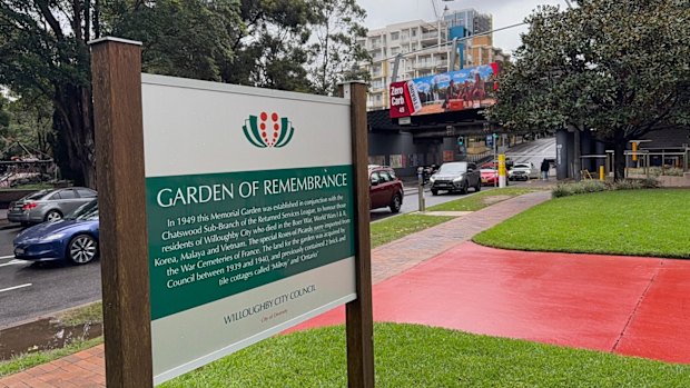 The large electronic billboard is on a railway bridge in Chatswood across the street from the Garden of Remembrance.