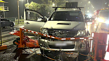 Chaos erupted at the gates of the Gold Coast 500 on Friday night after an alleged out-of-control driver ploughed into two pedestrians.