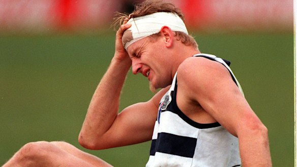 Former AFL player John Barnes copped several big hits in his career and says he is now unable to perform simple tasks. 