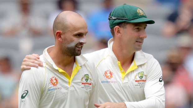 Chief destroyer: Nathan Lyon is hugged by Shaun Marsh after dismissing Rishabh Pant.