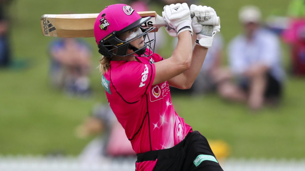 Superstar: Ellyse Perry hits a six to win the game and send the Sixers into the Women's Big Bash League final.
