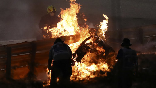 Romain Grosjean's car burns after he escaped the crash.