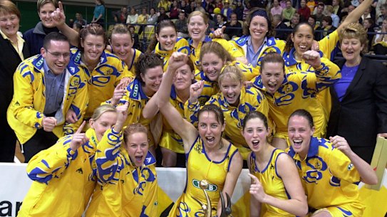 Briony Akle, Megan Anderson and the Sydney Swifts celebrate victory in the Commonwealth Bank Trophy grand final in 2001.