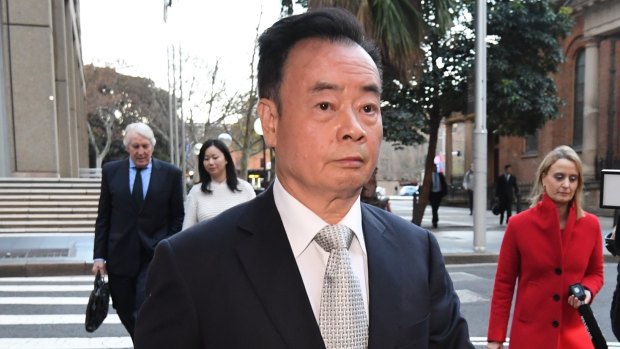 Businessman Chau Chak Wing, who is suing Fairfax Media for defamation, leaves the NSW Federal Court.
