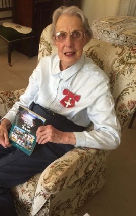 Alison Todd on her 88th birthday with a copy of her life story.
