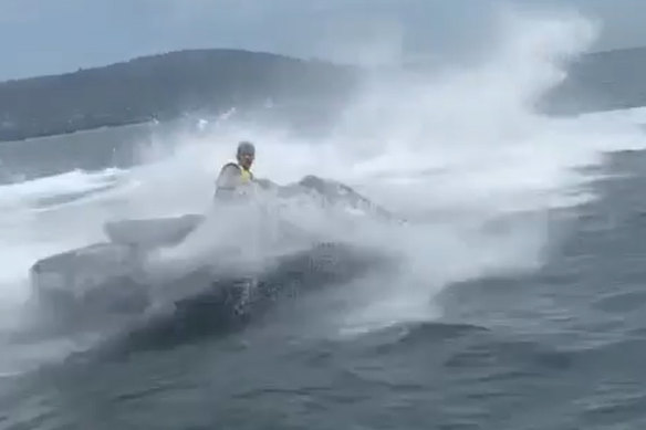 The 16-year-old jet-skier rode at speed towards the boat before taking a sharp turn and spraying the occupants with water.