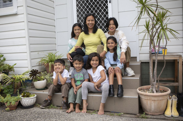 Faith Labaro (centre) with her children (bottom from left) Daniel, 4, Gabriel, 3, Nyomi, 7, and (top row) Stephanie, 12, Jazzmin, 9, and Samantha, 16. 
