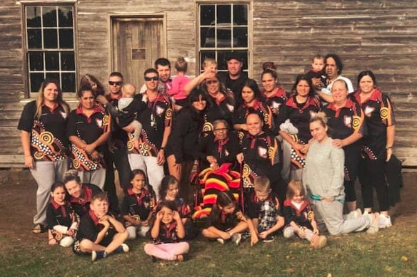 Eunice Wright (centre, with red, yellow and black blanket on her knees) and her mob outside her childhood dormitory at the Lake Condah Mission. “Her family was her world,” her daughter Tina says. 