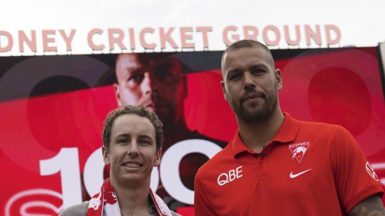 Sydney Swans fan Alex Wheeler giving back the 1000th goal ball to Lance Franklin this morning in Sydney.