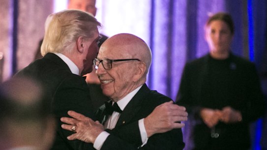 Rupert Murdoch and then US president Donald Trump embrace at a function in 2017.