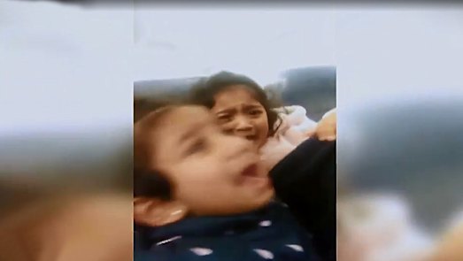 Kopika and Tharunicaa, aged four and two, on the charter plane to Darwin on Thursday night. 
