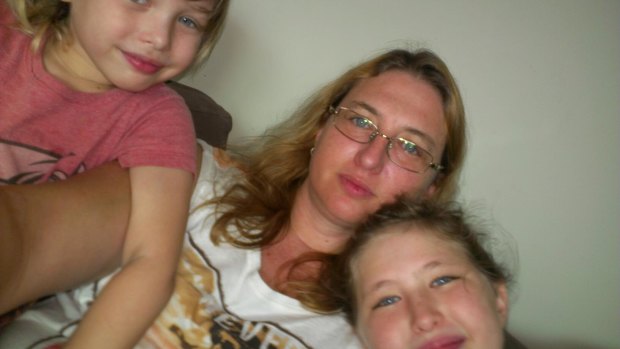 Taylor is unrecognisable after going hungry in a Cambodian prison. Her with children Kahlyla, left, and Archer, right.