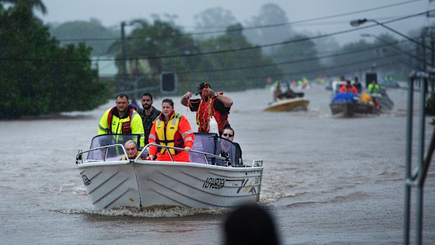 People are rescued by boat in Lismore on Monday