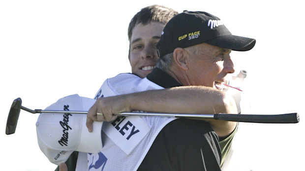 Aaron Baddeley hugs caddie Pete Bender after winning the FBR Open in 2007.
