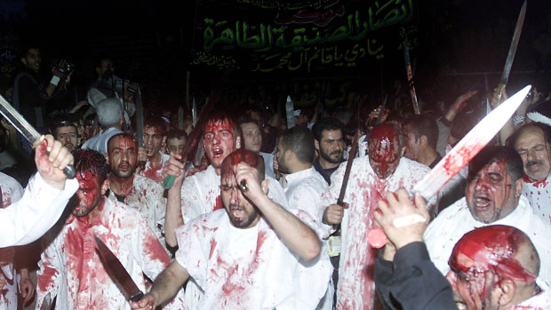 Shiite Muslims conduct the rites of Ashura in Sayyida Zeinab, south of Damascus, in 2004. Such displays have become more visible with Iran's increased influence.