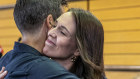 New Zealand Prime Minister Jacinda Ardern, right, hugs her fiancee Clark Gayford.