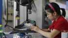 Workers assemble sneakers in a Jinjiang factory. 