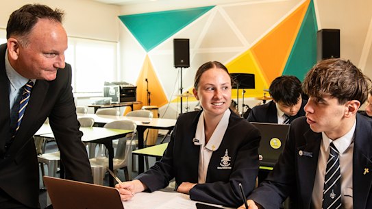 Clancy Catholic College principal David Costin with year 12 students.