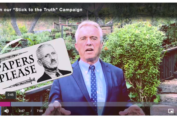 In this image from video posted on the Children’s Health Defence website, Kennedy talks about the anti-vaccine stickers he’s urging supporters to use.