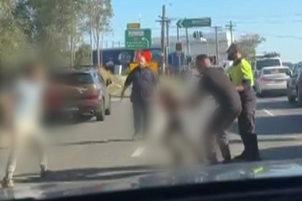 Bystanders ran to the scene on the side of the motorway.