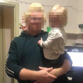 The father and alleged murderer from Lalor Park with one of the children.