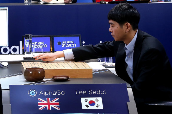 South Korean professional Go player Lee Sedol puts his first stone against Google’s artificial intelligence program, AlphaGo.