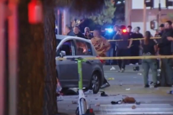 A car is seen on Santa Monica Boulevard where at least 20 people are reported to have been struck.