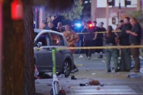 A car is seen on Santa Monica Boulevard where at least 30 people were injured.