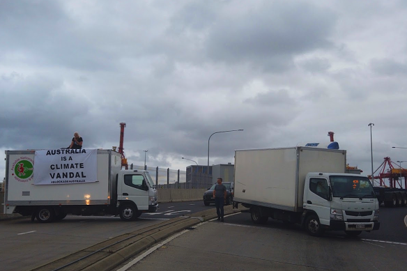 Blockade Australia activists Helen and Dom disrupt traffic at Port Botany on Wednesday afternoon.