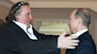 French actor Gerard Depardieu, left, greets Russian President Vladimir Putin in 2013.