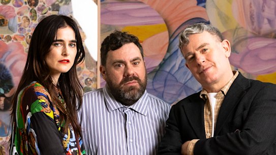 Romance Was Born’s Anna Plunkett and Luke Sales with artist Samuel Hodge who created a portrait of the designers unveiled at the National Portrait Gallery in Canberra.